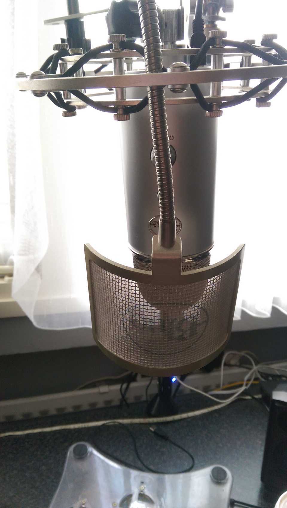 picture of the new blue yeti on a mic arm